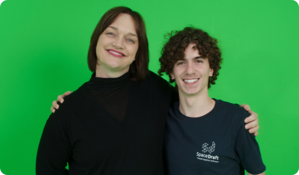 Nicole Spanbroek, Media teacher, standing with a person wearing a SpaceDraft shirt against a green screen background.